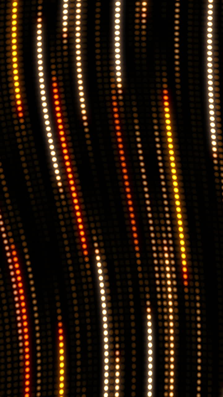 Yellow waves from glowing round dots. Dynamic movement and glow pattern. Abstract looped background with bokeh. Vertical video.
