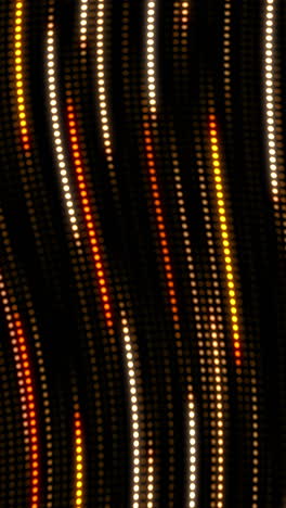 yellow waves from glowing round dots. dynamic movement and glow pattern. abstract looped background with bokeh. vertical video.