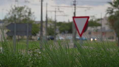 a road sign against the backdrop of grass