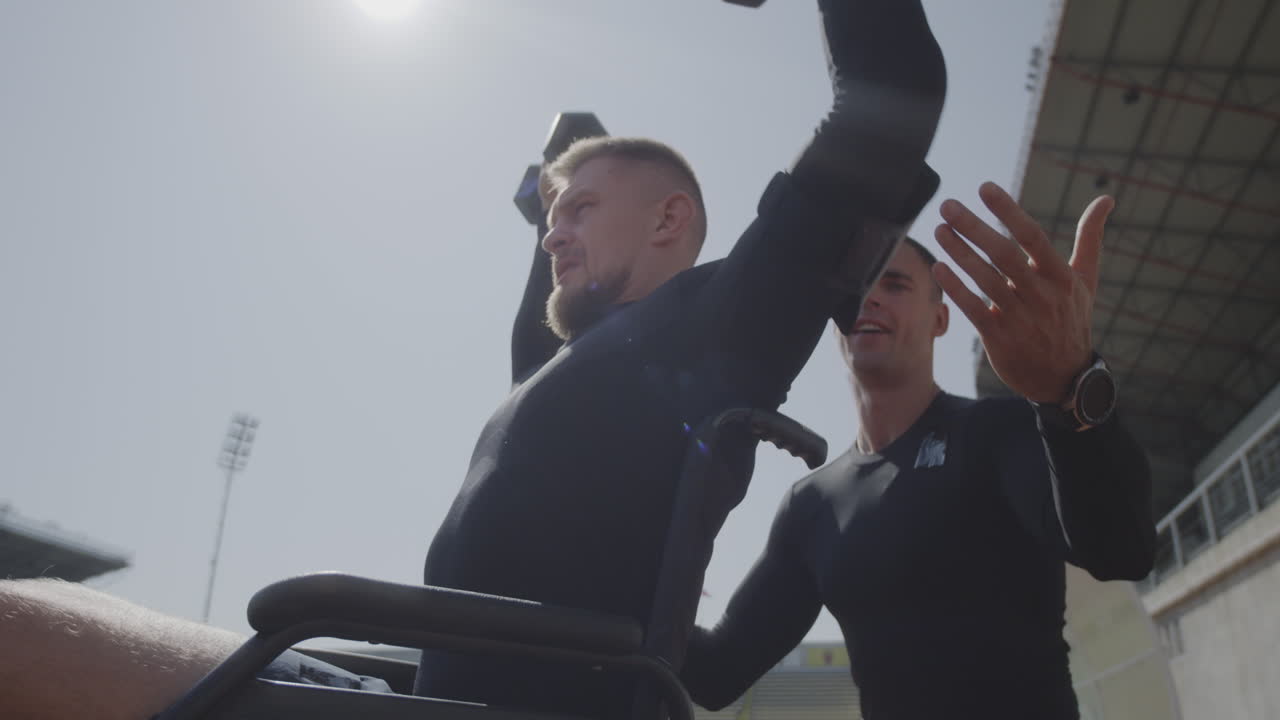 Disabled person working out with a personal trainer