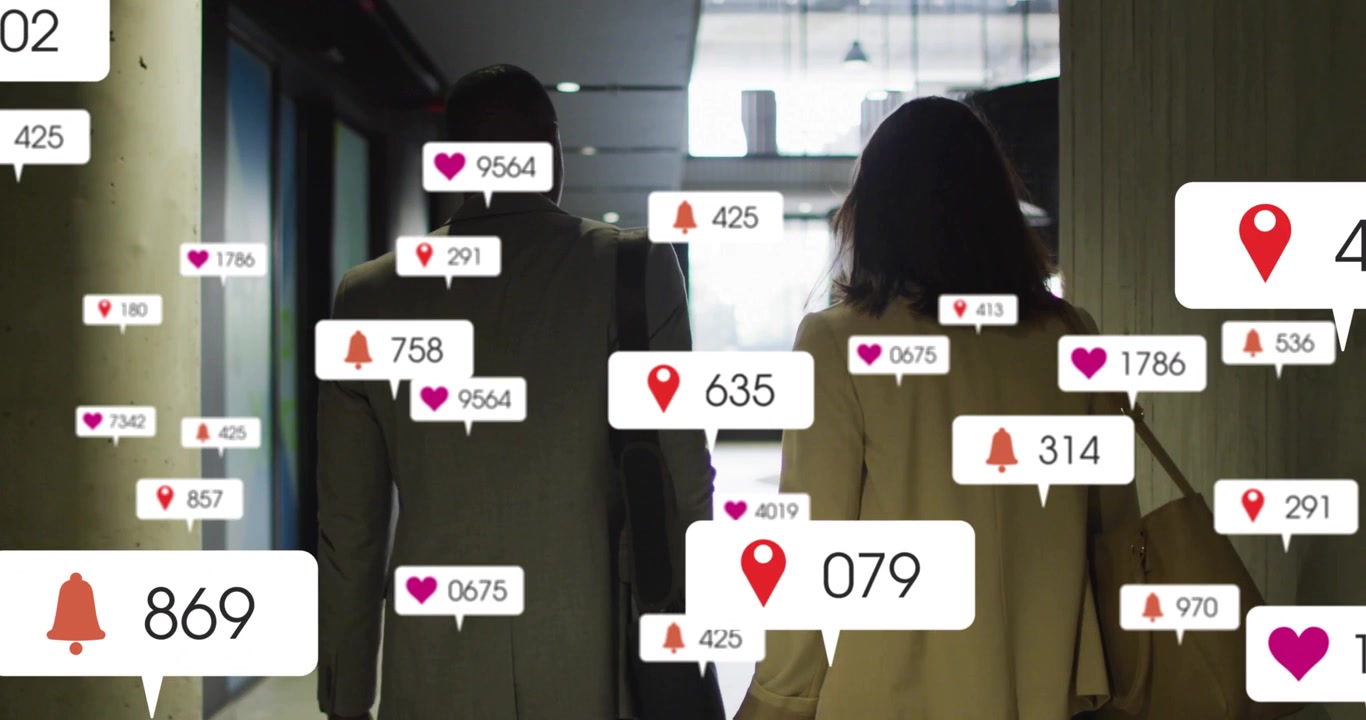 Business pair walking to exit, spawning pins, hearts, bells multiplying around shoulders