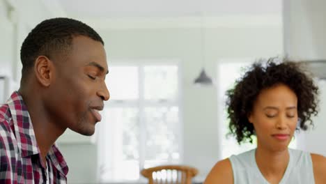 Black-couple-praying-together-at-home-4k