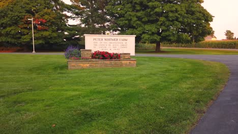 The-Road-Sign-on-the-Historic-site-and-visitors-center-at-the-Peter-Whitmer-Farm-location-in-New-York-in-Seneca-County-near-Waterloo-Mormon-or-The-Church-of-Jesus-Christ-of-Latter-day-Saints