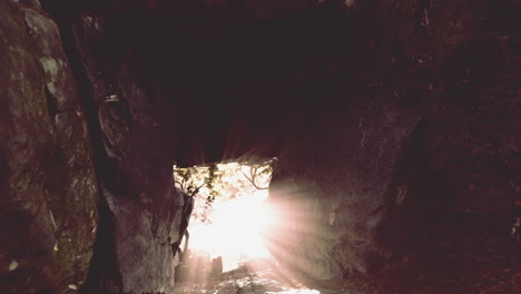 sunlight shining through a cave opening