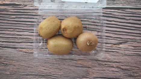 kiwi fruit in plastic container