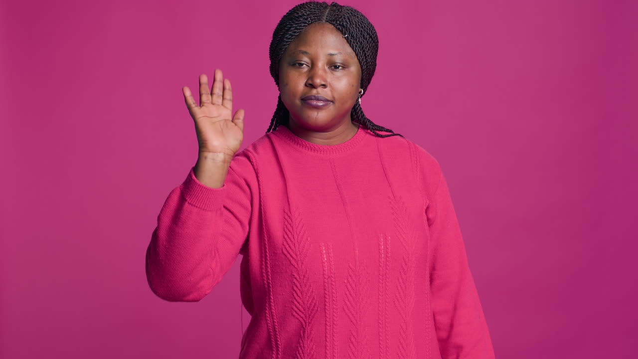 Lady Using Stop Gesture Towards Camera