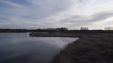 epic landscape view of lake wintertime - dolly in shot