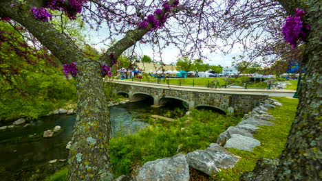 time lapse - people walk across bridge on sager creek, siloam springs, arkansas