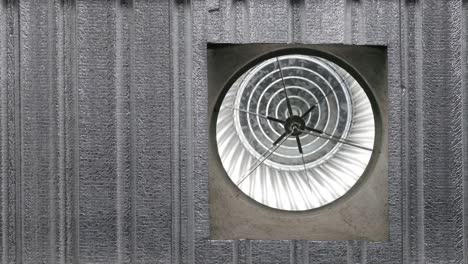 circular rotation of an exhaust fan or centrifugal fan attached to the ceiling of a market building