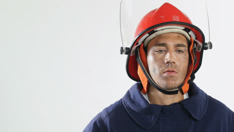 thoughtful fireman looking up against white background 4k 4k