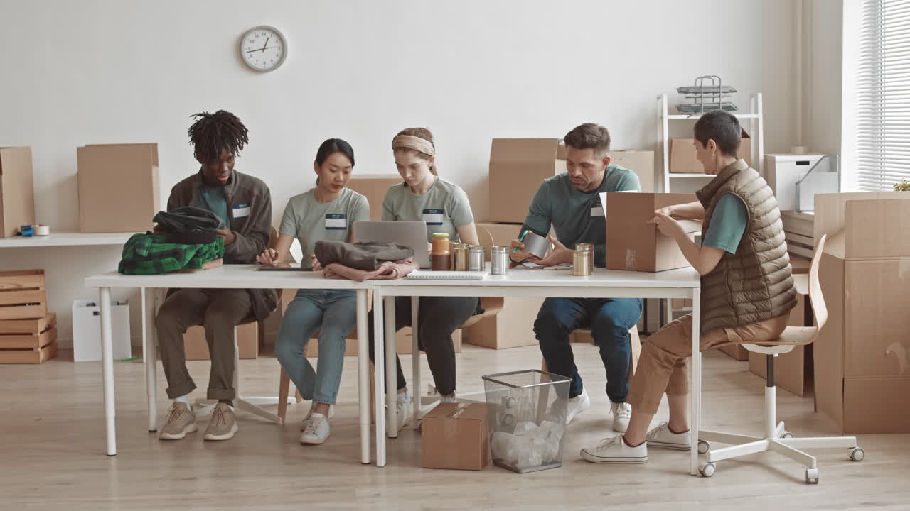 Volunteers packing food donations at a food bank