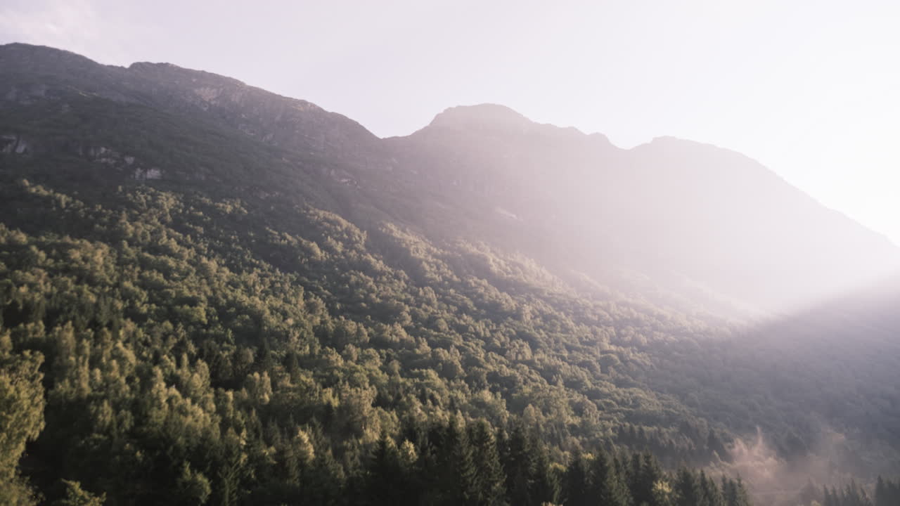 First sun rays of the day hitting Norwegian Mountains (Time Lapse)