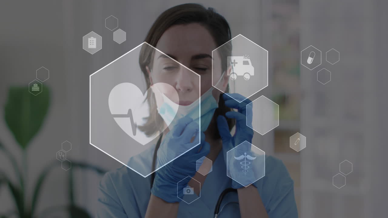 animación de iconos médicos sobre una doctora caucásica con máscara facial en el hospital