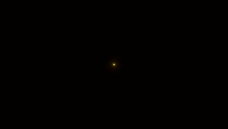 el destello realista de la lente de luz sobre un fondo negro.