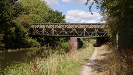 Mid-shot-of-Trent-and-Mersey-Canal-with-metal-Bailey-bridge-across-the-canal-and-towpath