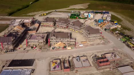 Birds-eye-view-drone-shot-homes-under-construction-at-building-site