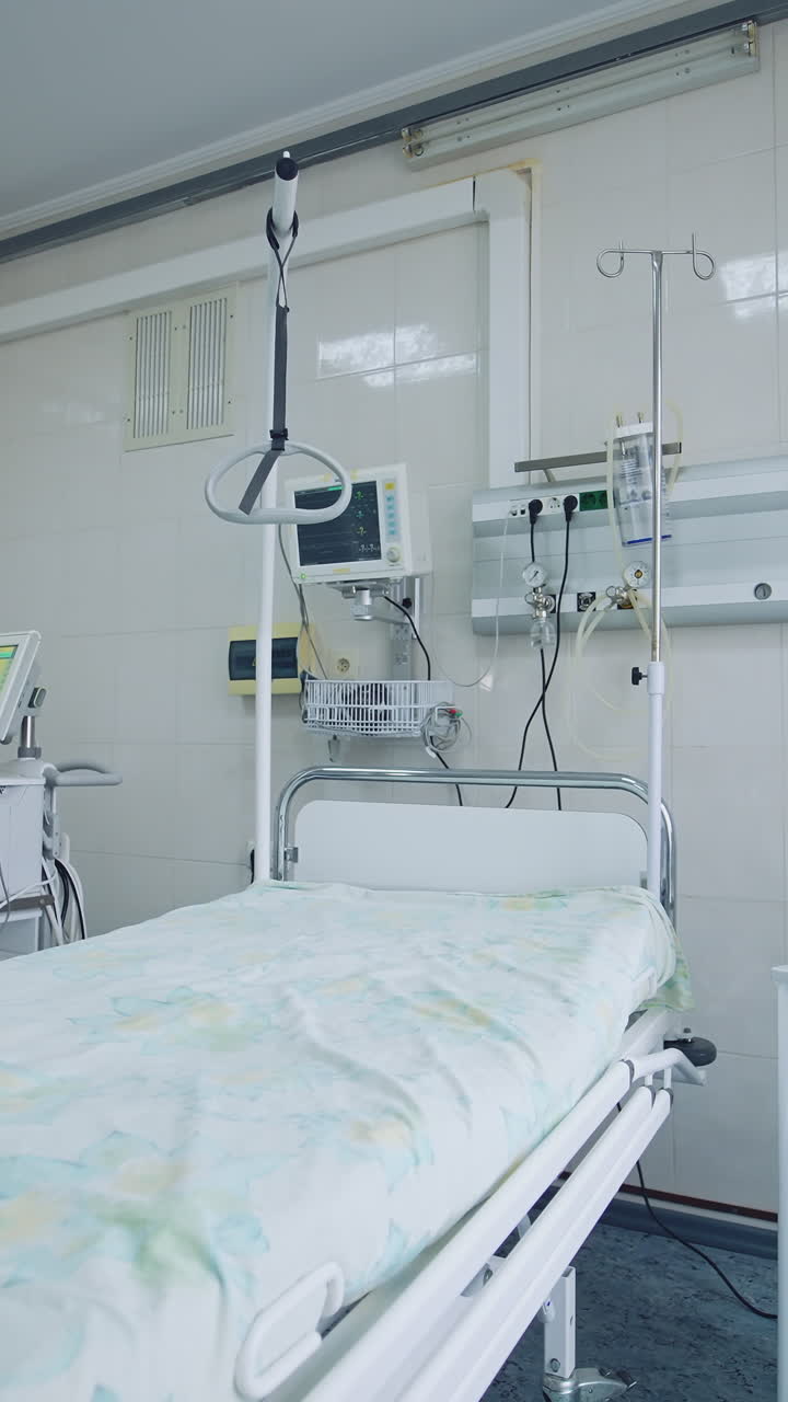 New hospital bed and equipment in a clean room. Empty intensive care room. Hospital bed with modern medical equipment in clinic. Vertical video