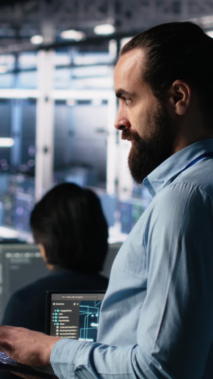 Vertical video Server room technician using AI LLM chatbot to review infrastructure diagnostics