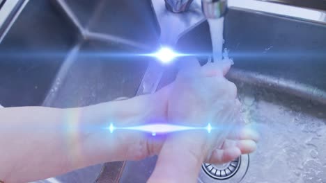 Animation-of-light-moving-over-hands-of-senior-woman-washing-in-kitchen-sink