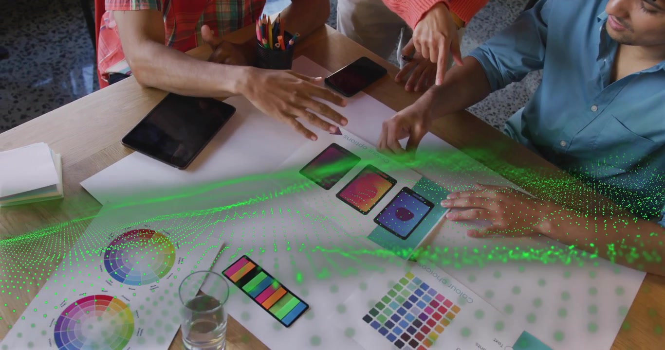 Design team arranging gradient cards and activating green AR wave overlay for sample layout preview