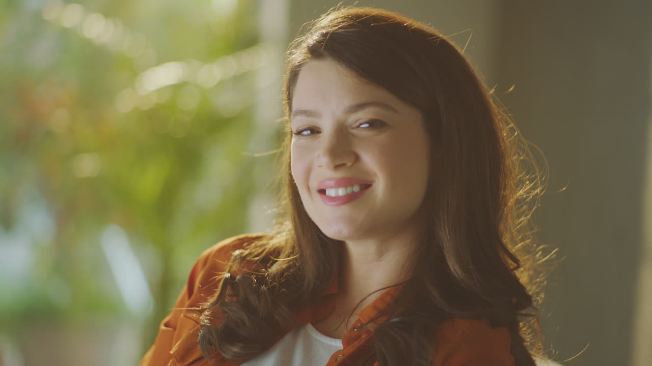 Pregnant Woman Smiling and Touching Her Belly