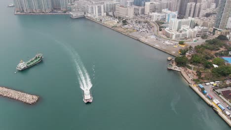 Hong-Kong-bay-coastline-and-waterfront-skyscrapers,-Aerial-view