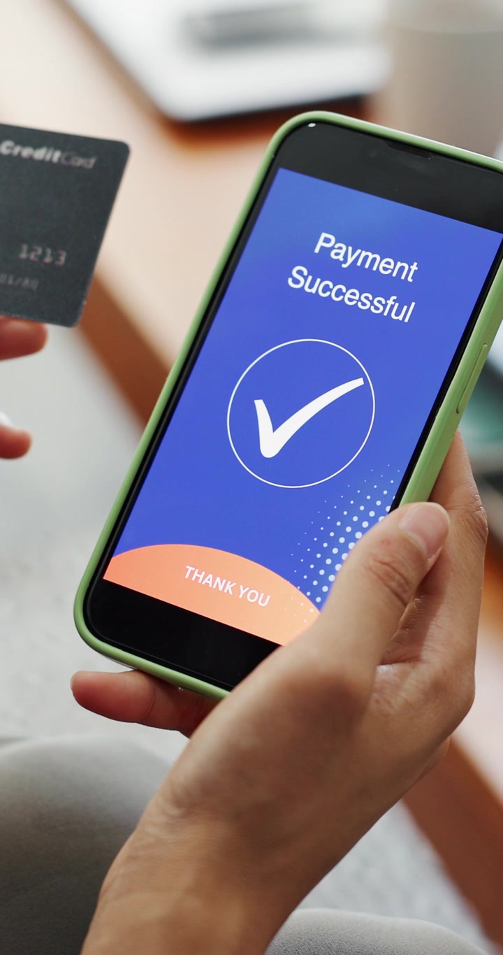 Person Making a Successful Mobile Payment with Credit Card