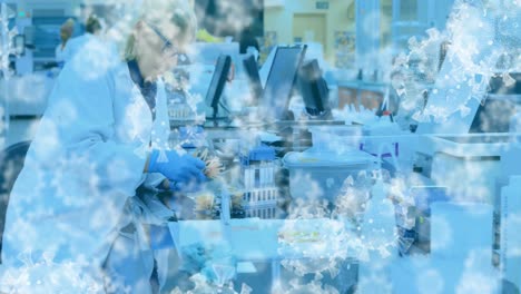 covid-19 cells against female scientist working in laboratory