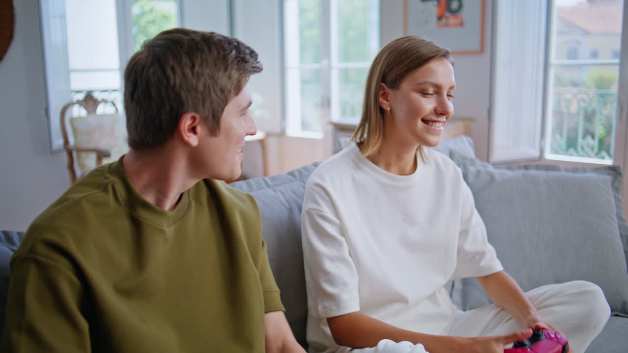 Girl lost online game with boyfriend at home zoom on. Guy comforting girlfriend