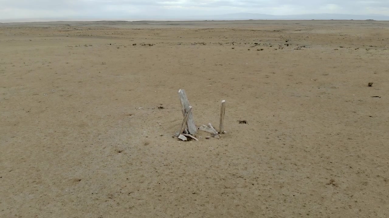 Aerial View of Isolated Stone Monoliths in Vast Desert Landscape