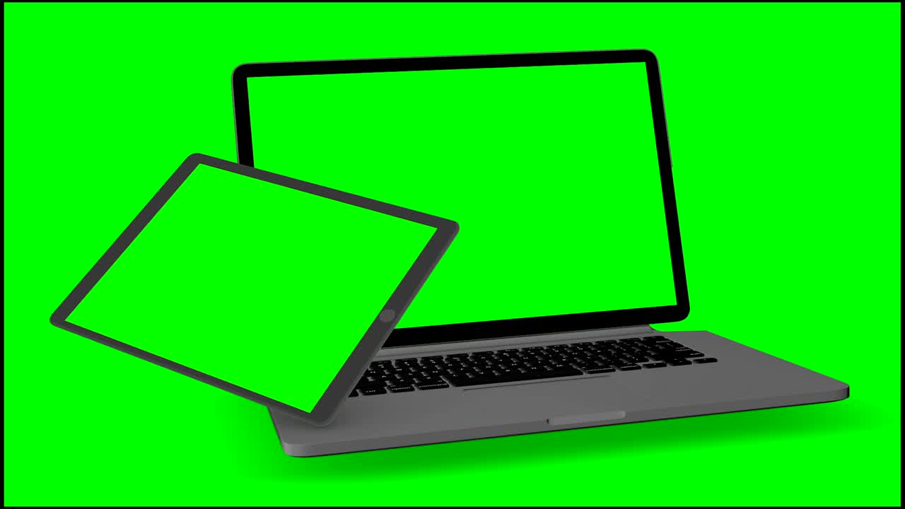 vídeo 4k. portátiles (notebook) y tabletas que se encienden con pantalla verde sobre un fondo verde.