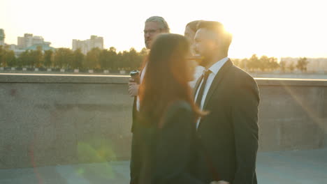 business professionals enjoying coffee break outdoors