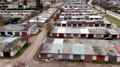 establishing, aerial view of privately owned old fashioned car garages from soviet era in lithuania, silute