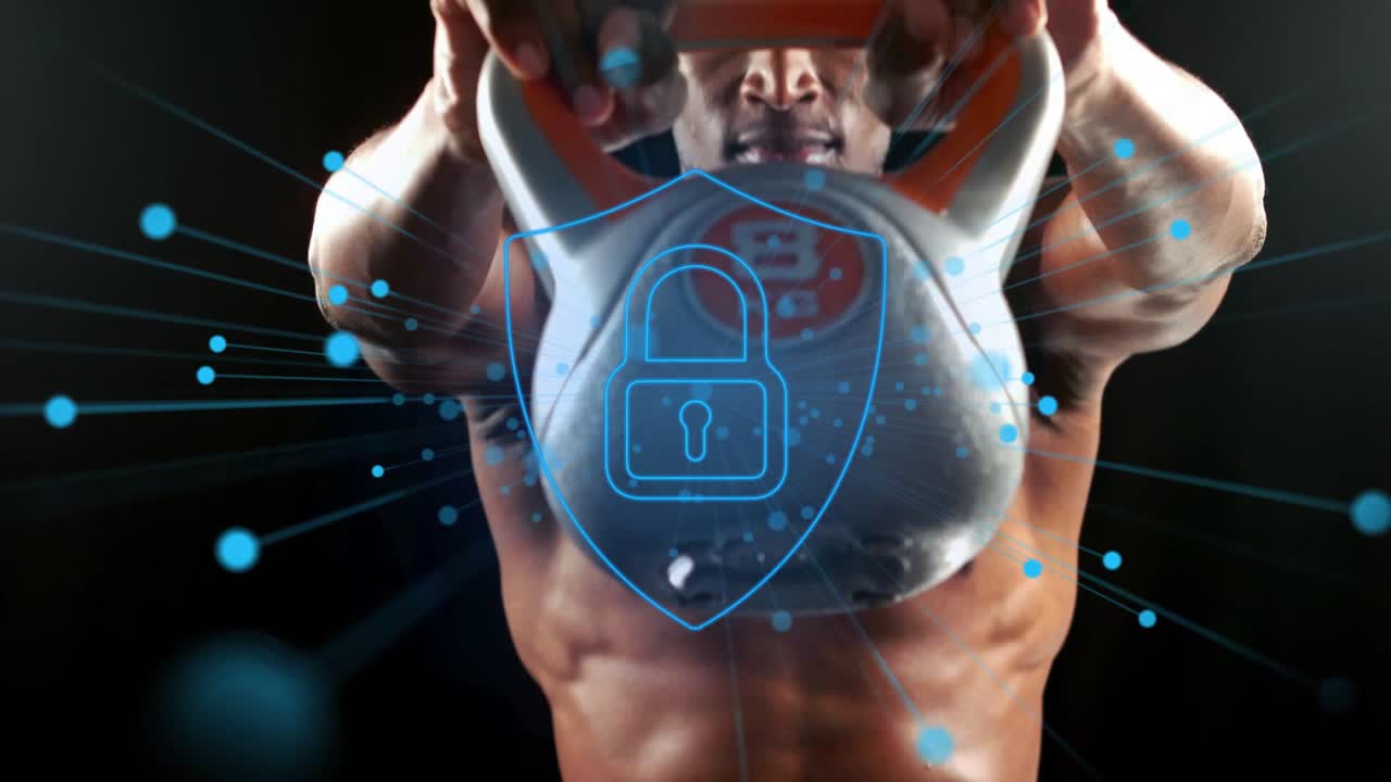 Male athlete pulling kettlebell upward in studio after gripping, padlock particles syncing fitness