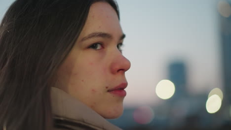 close-up of a girl s face with a soft focus, set against a blurred background. the shot highlights her delicate features and evokes a serene, intimate atmosphere with gentle visual aesthetics