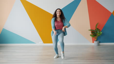woman dancing in colorful room