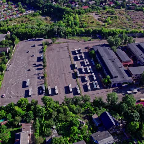 aerial view of a bus depot in a suburban area