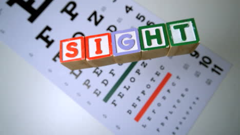 blocks spelling out sight falling onto eye test