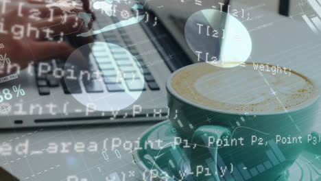 person typing on a laptop with a cup of coffee