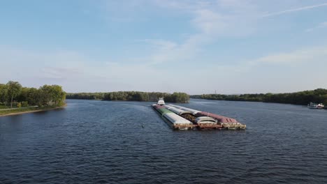 large barge transporting cargo on the mississippi river in la crosse, wisconsin