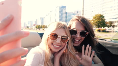 two friends enjoying a road trip in a convertible