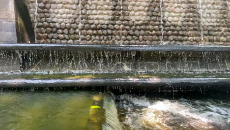 dirty water from the nezahualcoyotl fountain flowing by gravity towards mexico city