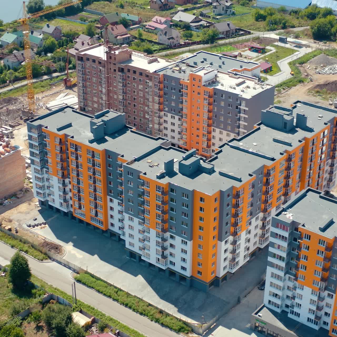 Multi-storey apartments in new area. Construction of a modern residential complex. Modern high rise architecture. Aerial view
