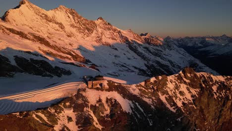 aerial panorama: mountain ridge lit by a sunrise, breathtaking view