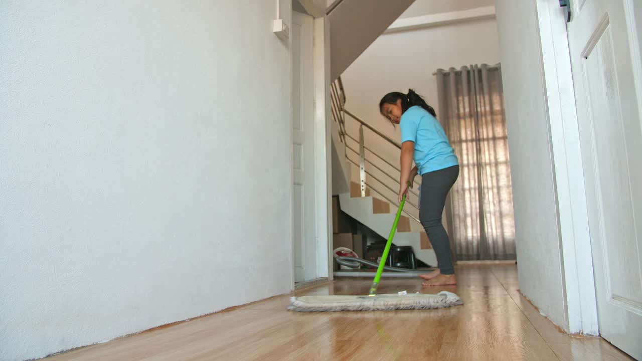 Asian Girl Cleaning With Mop