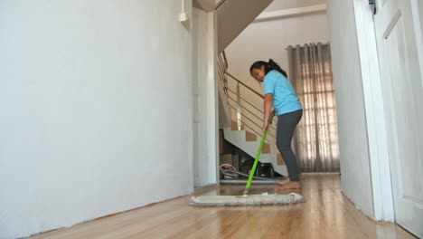 asian girl cleaning with mop