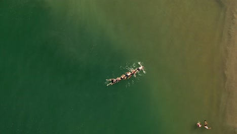 people floating in a lake
