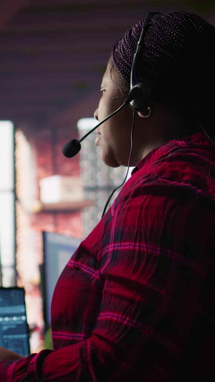 Vertical video Call center worker in office using AI chatbot to reply to customers