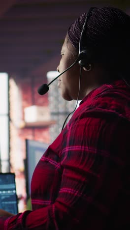 vertical video call center worker in office using ai chatbot to reply to customers