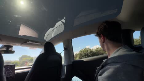 Person Driving a Car on a Road Trip